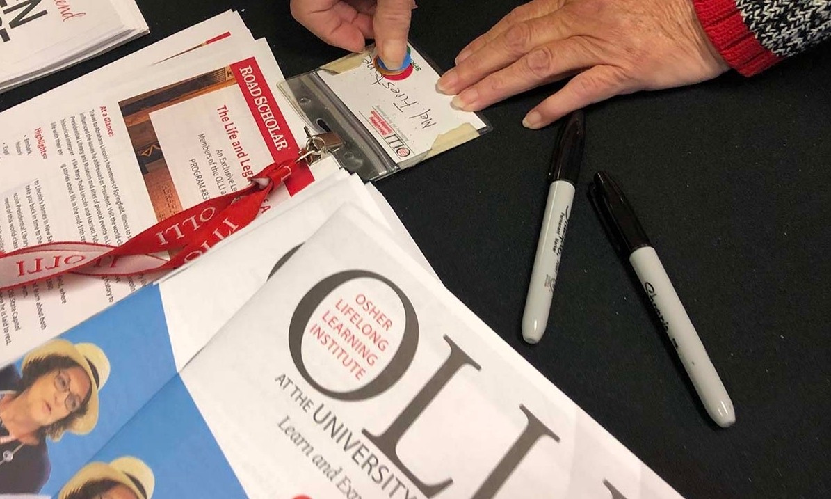 Close up of a table with class catalogs and brochures